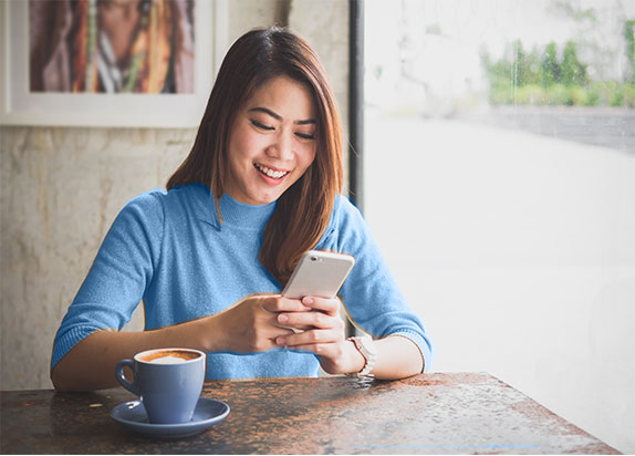 woman looking at mobile phone